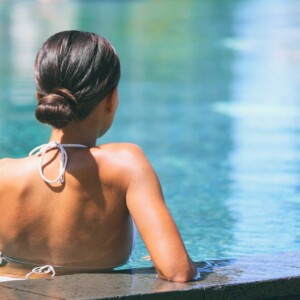 lady lounging in pool